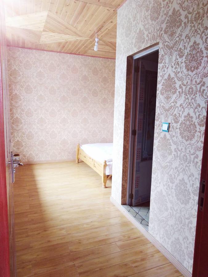 Zishuo Zihua Guest House Daocheng Esterno foto